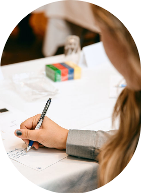 A Sollio Agriculture employee taking handwritten notes during a training.