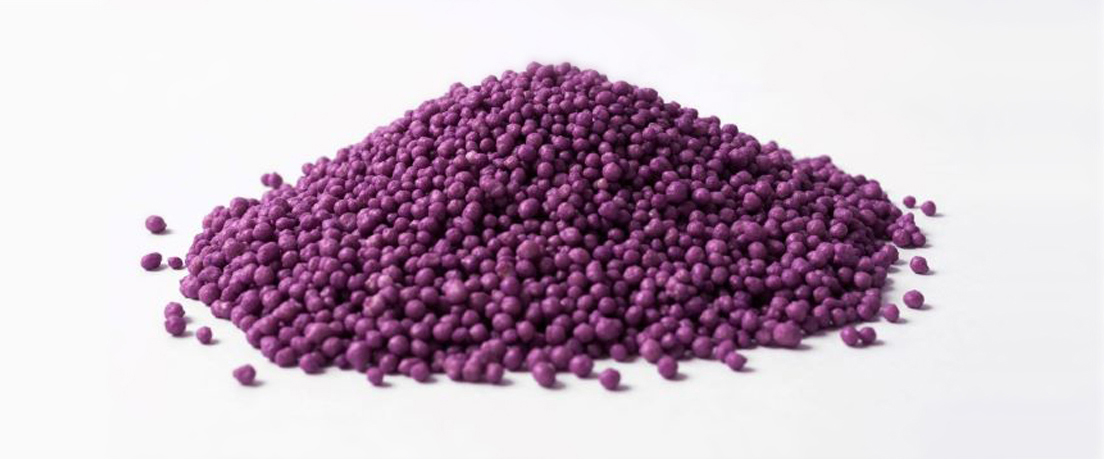 Pile of controlled-release fertilizer particles coated with Pursell's exclusive patented technology.